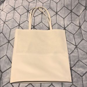 Large cream colored tote bag. Saks fifth avenue